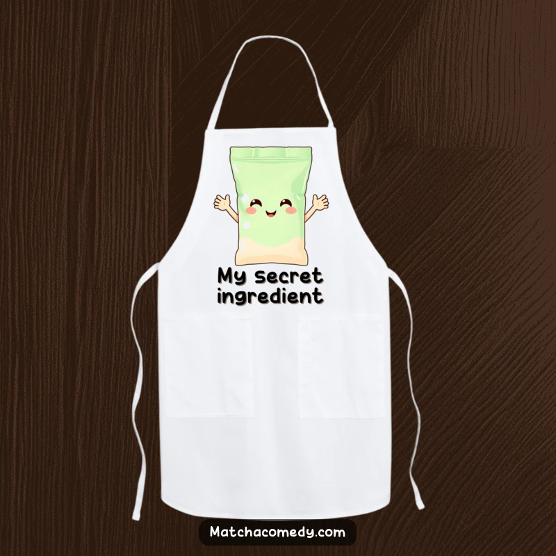 Funny matcha powder bag with arms waving happily, printed on a functional kitchen apron. Whimsical and practical.