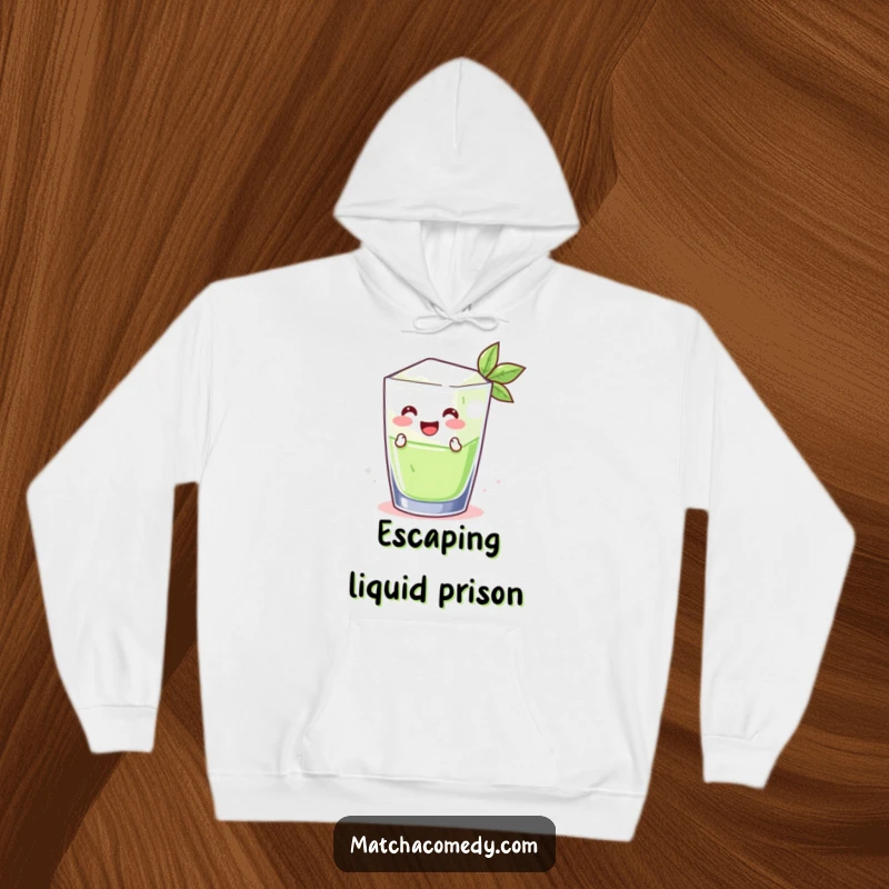 Funny smiling matcha ice cube jumping out of a glass, featured on a soft, warm hoodie. A cool and humorous garment.