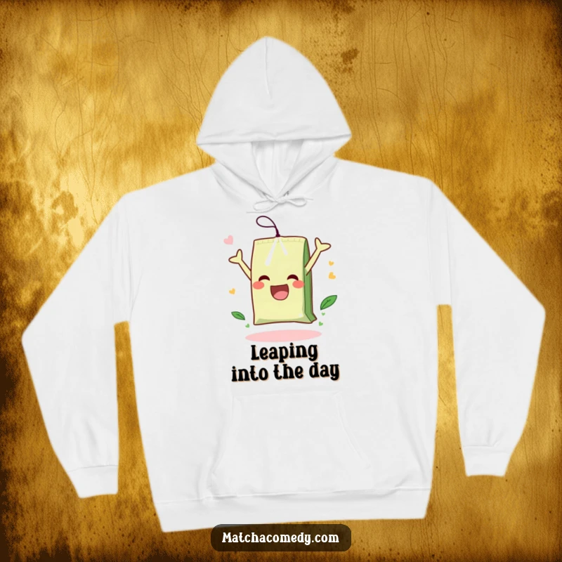 Funny hoodie with a charming illustration of a matcha tea bag happily performing a somersault, bringing smiles.