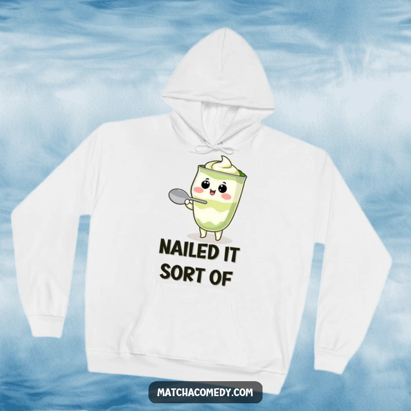 Funny Kawaii matcha latte character attempting to balance a spoon, plush and warm, celebrating matcha lovers with a humorous design.