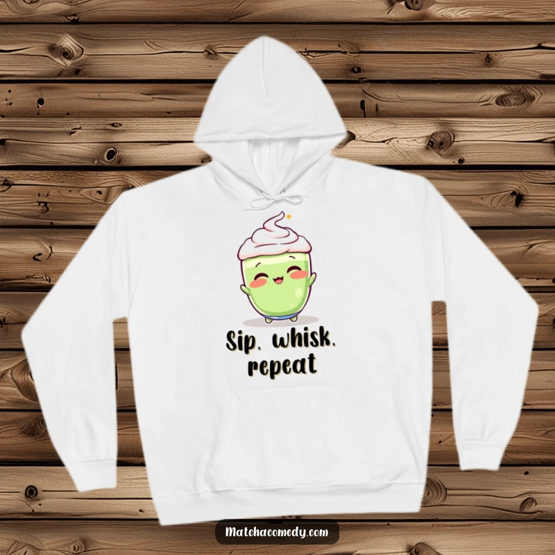 Funny, vibrant matcha latte in a playful whisking motion, featured on this warm and humorous hoodie.