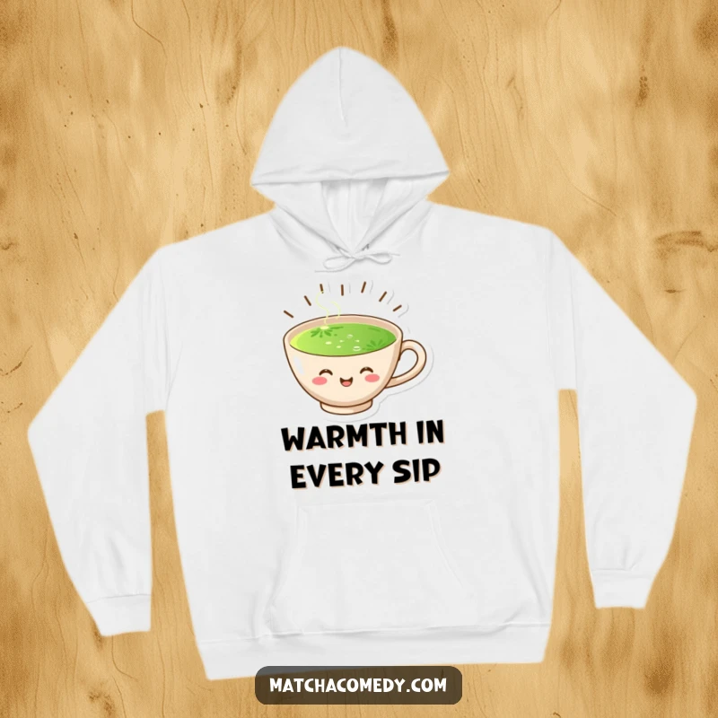 Funny hoodie depicting a joyful matcha cup with radiating steam, offering warmth and a cheerful vibe for the wearer.
