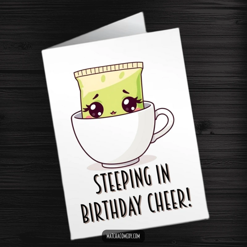 Funny Free Printable Birthday Card: Surprised matcha tea bag peeking from steaming cup with wide, shocked eyes.
