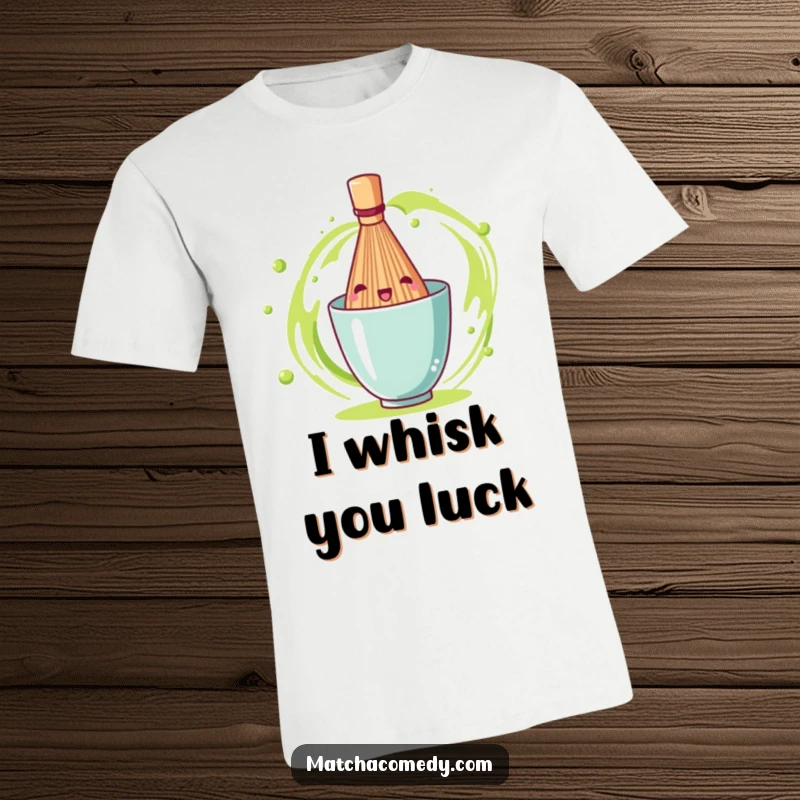 Funny matcha tea whisk in mid-spin with visible motion lines, embodying cheerful energy on this graphic t-shirt.