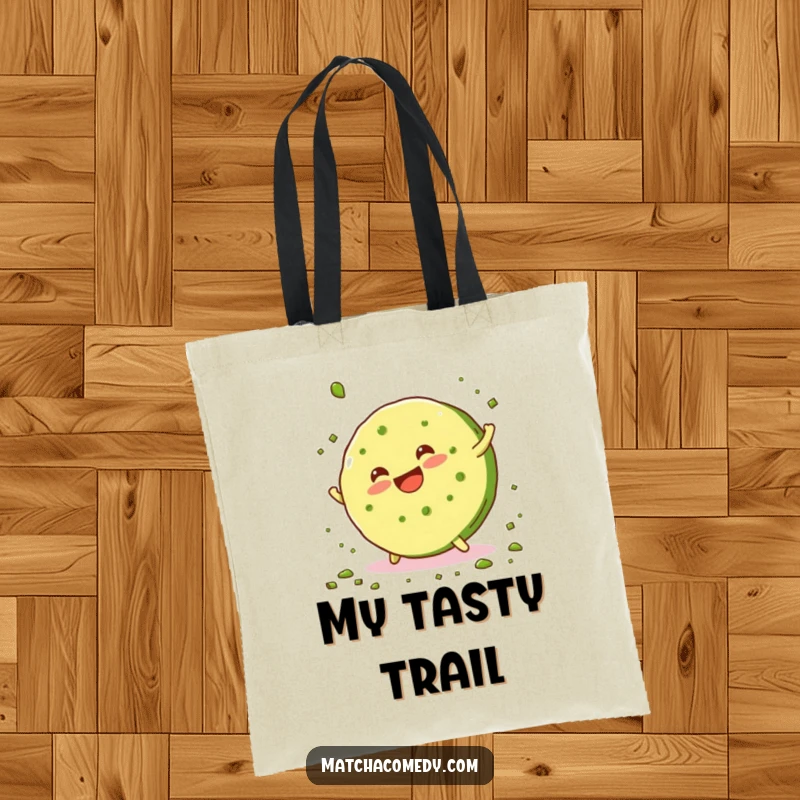 Funny, smiling matcha cookie doing a cartwheel and scattering crumbs on this practical and humorous tote bag.